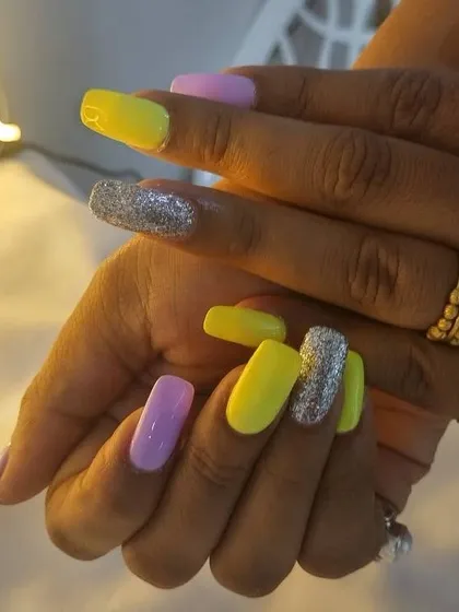 Another look at the neon pastel colorblock nails. The combination of yellow, lilac, and silver glitter is amazing.