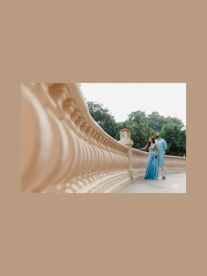 An artistic shot using architectural lines to frame the couple during their Haldi event at the Westin Mumbai. This composition adds a sense of scale and design to the portrait.
