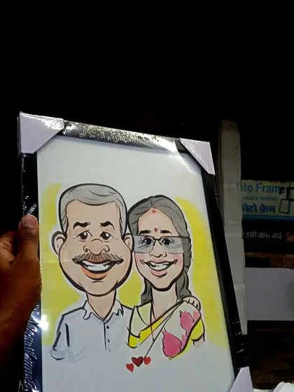 A commissioned caricature of a couple, framed and protected, making it a durable and lasting memento.