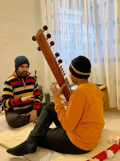 In the Guru-Shishya tradition, communication is key. I explain the nuances of a phrase, ensuring the student understands the feeling behind the notes, not just the technical execution.