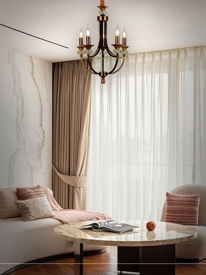 Here, the chandelier's warm glow transforms the living space into an extraordinary realm of beauty. The lighting works in concert with the decor to create a truly opulent and inviting atmosphere.