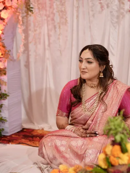 A candid shot of the bride during her engagement ceremony.