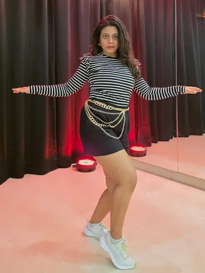Striking another pose. Dance is not just about movement; it's also about how you hold yourself and express your personality.