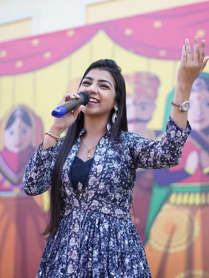 'Gaata rahe mera dil'. A joyful shot of me singing at an outdoor event.