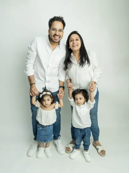 A classic family portrait is something you'll cherish forever. I love getting the whole family together, including these adorable twins, for a fun studio session that captures everyone's unique personalities.