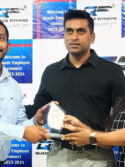 Presenting the 'New Bee' award to Mr. Sathish for his excellent performance as a new member of our team. He has shown incredible potential.