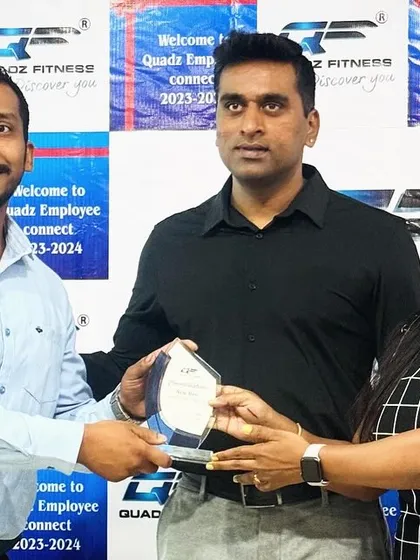 Presenting the 'New Bee' award to Mr. Sathish for his excellent performance as a new member of our team. He has shown incredible potential.