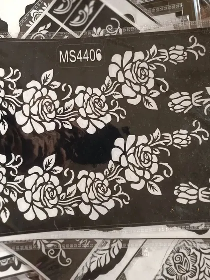 A lovely rose vine stencil. This design is perfect for creating a flowing pattern along the side of the hand or arm.