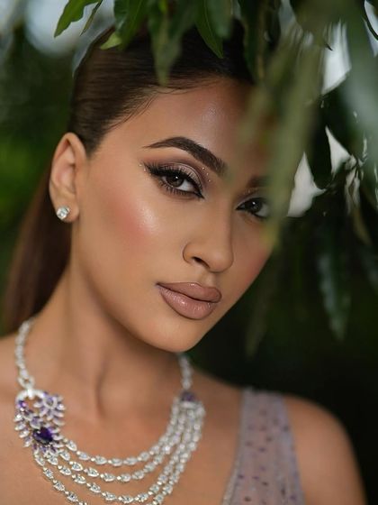 A peek-a-boo shot that adds a touch of mystery and highlights the stunning eye makeup. We love getting creative with our photography to showcase our work.