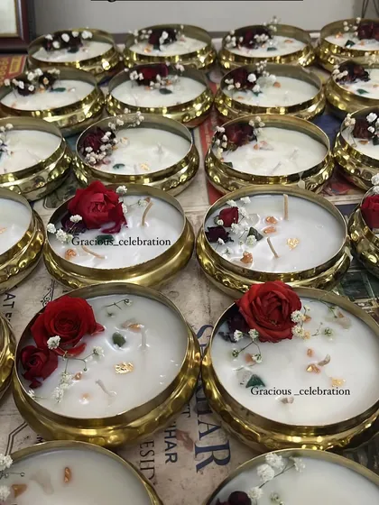 Urli candles are very trending for Diwali. These brass urlis are filled with scented soy wax and decorated with real flowers. They are completely reusable, making them a sustainable gift.