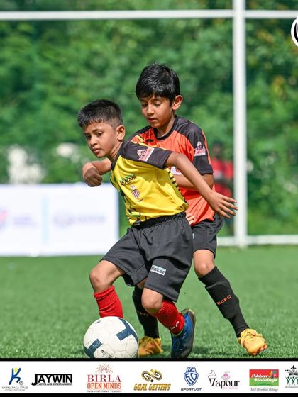 A physical battle for the ball. Our players are taught to compete fairly but fiercely for every possession.