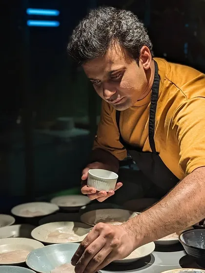 Chef Karan Upmanyu plating a dish during our cacao and corn-themed dinner. The focus and precision in the kitchen are what allow us to deliver perfectly executed, multi-course tasting menus.