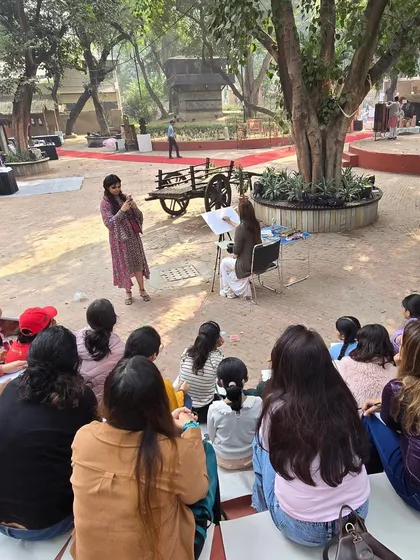 A wide shot of our outdoor class, with students gathered to learn from an instructor in the beautiful, open setting of the Craft Museum.