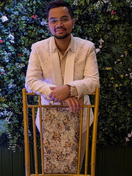 A happy client looking dapper in our textured off-white blazer. This is a versatile piece that works for both daytime and evening events, giving a clean and stylish look.