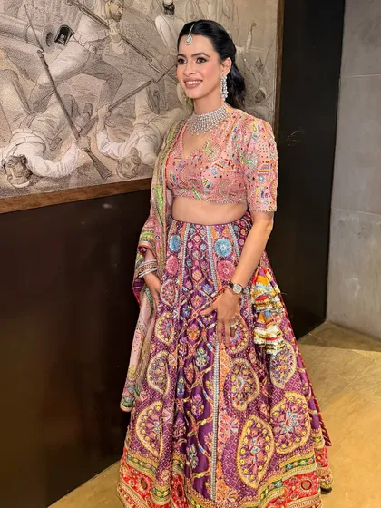 A full view of Priyanka's vibrant party look. The makeup is kept fresh and radiant to complement the colorful Mayyur Girotra lehenga.