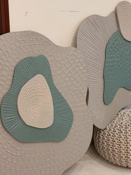 Another view of the textured wall sculptures. These pieces are lightweight and can be hung together or separately to create a custom wall installation.