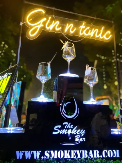 A dedicated 'Gin n tonic' station, complete with a custom neon sign and elegant glassware. This setup is perfect for gin lovers, offering a curated experience focused on this classic drink.