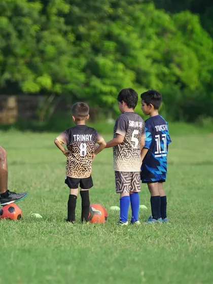 Here I am demonstrating proper technique to our young players. We believe in hands-on coaching, providing clear instructions and individual attention to ensure every player understands the fundamentals of the game.