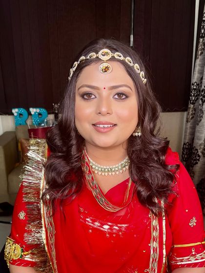 A smiling portrait of our bride, looking radiant in her traditional Haldi attire.