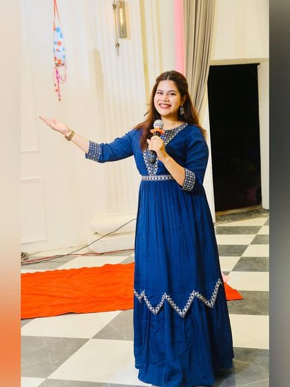 A simple yet elegant blue gown for a daytime engagement function.