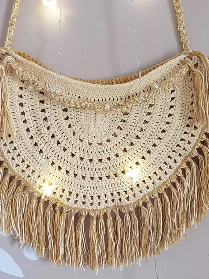 The Callaia Bag styled with fairy lights to highlight its dreamy, ethereal quality.