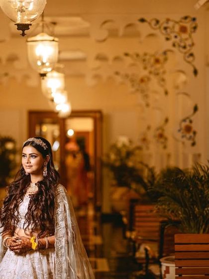 A beautiful portrait of the bride at her Sangeet in the elegant corridors of the Trident Udaipur.
