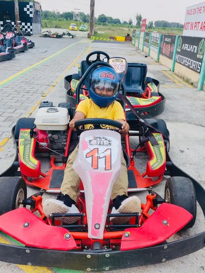 A young driver looking confident and ready to go in one of our baby karts. We make sure the experience is safe and fun for all age groups.