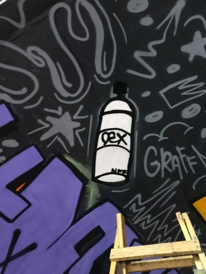 A close-up detail from the "HIPHOP INDIA" tunnel mural. The piece is filled with small hip-hop and graffiti culture references, like this stylized spray can with my "DEX" tag.