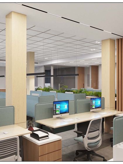 In this design for a developer in Fort, we blended contemporary furniture with the building's structure. The light wood columns and sleek workstations create a modern feel within a historic context.