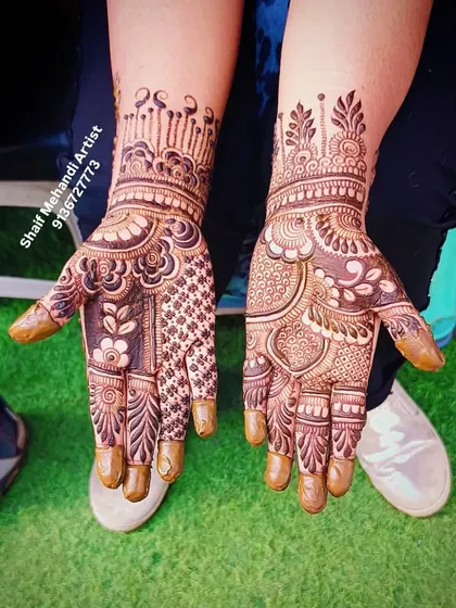 A clear shot of the same traditional design, highlighting the crown-like pattern at the wrist.