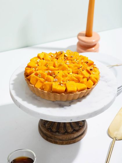 Our mango tart, a perfect circle of sunshine on a plate.