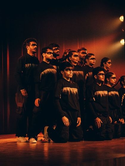 The crew in a final, unified pose for their performance about hope and resilience.