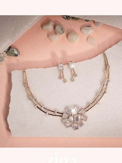 A sophisticated Italian necklace from our Zira collection. The centerpiece is a floral motif crafted from mother of pearl and brilliant CZ diamonds, set on a unique double-band collar.