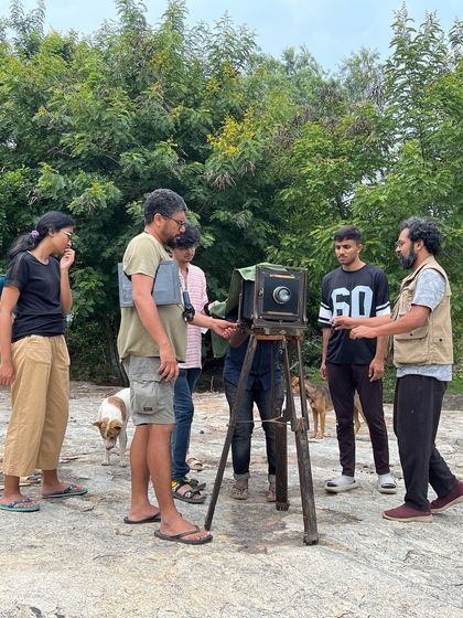 Participants in our photography program learning to use a large format camera during an off-site workshop. We explore a range of analog techniques, from modern film to historic processes.