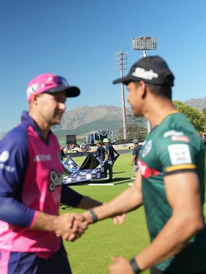 Shaking hands with Joe Root on the field. Mutual respect between professionals dedicated to the craft of sport.