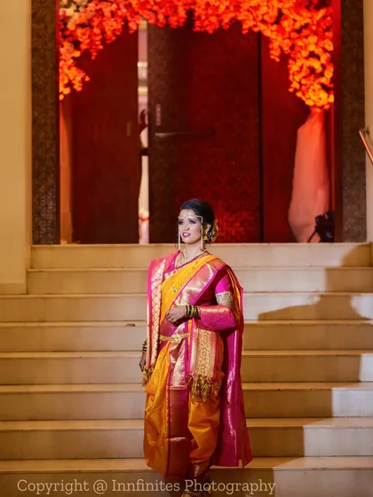 This portrait showcases the bride's full attire in all its glory. The grand staircase provides a beautiful setting for this elegant shot.
