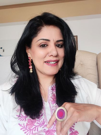 To complement the pink embroidery on the pheran, I paired it with these lovely pink enamel earrings and a matching ring. It’s a simple way to create a coordinated look.