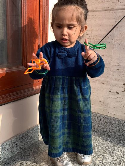 Celebrating the spirit of India for Republic Day with Firstcry. My daughter is wearing a beautiful blue and green woolen dress from their collection.