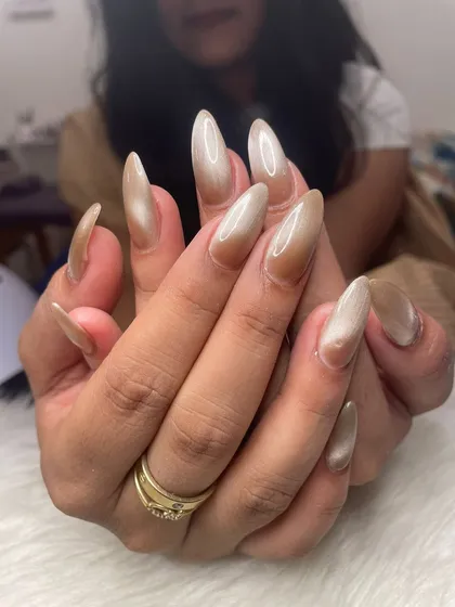 Another angle of the neutral cat eye nails, showing how the light catches the shimmer.