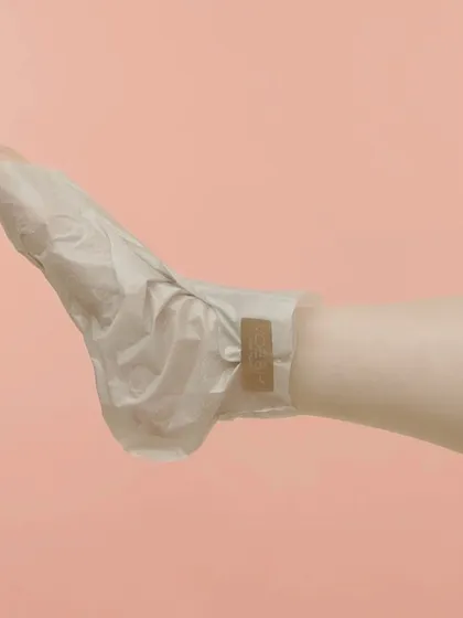 For the ultimate foot care, I use these vegan collagen socks. This photo shows how the sock envelops the foot, delivering a concentrated dose of moisture to heal and soften dry skin.