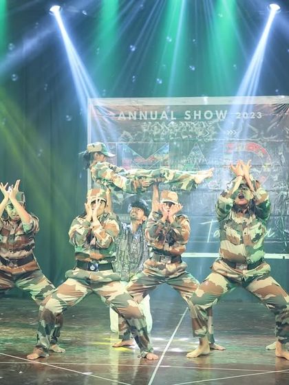 This formation from our army tribute act showcases precision and teamwork. The entire group moves as one, creating a powerful visual statement.
