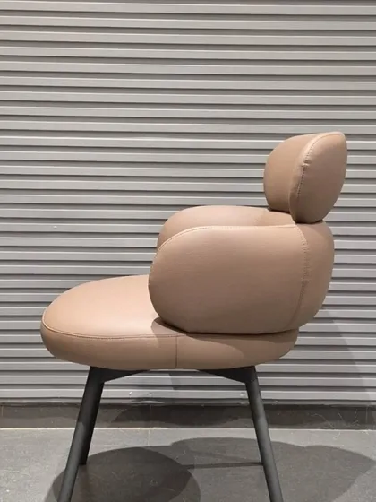 A side view of another new multipurpose chair, showing its unique, three-tiered backrest design.