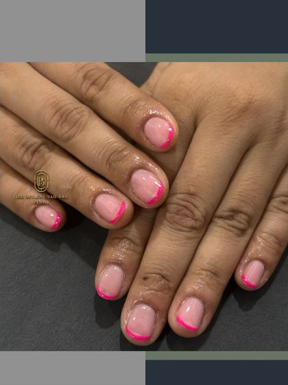 A simple and sweet pink French manicure. A fun, colorful twist on the classic look.