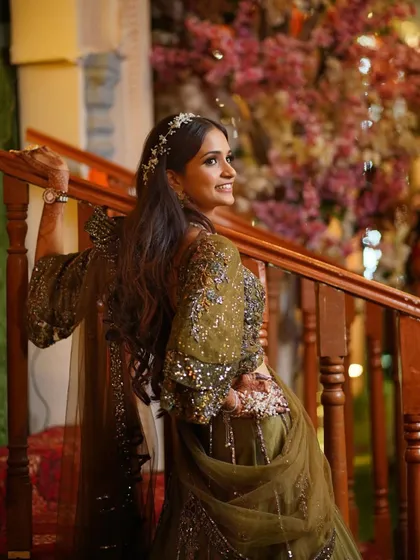 A candid shot on the stairs, showing the elegance of the outfit and the makeup.
