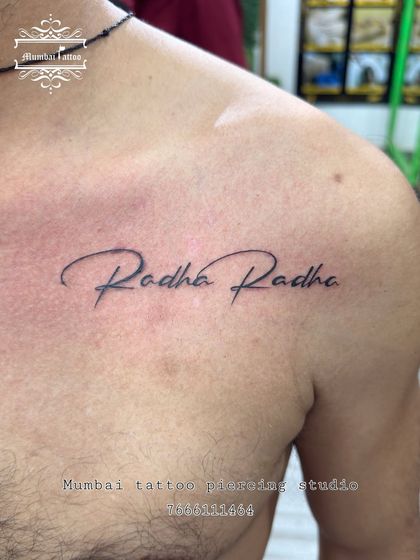 "Radha Radhe" tattooed on the chest in an elegant script. This is a beautiful expression of devotion, placed close to the heart.