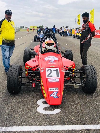 Final checks on the starting grid. Our team ensures every detail is perfect before the race begins.