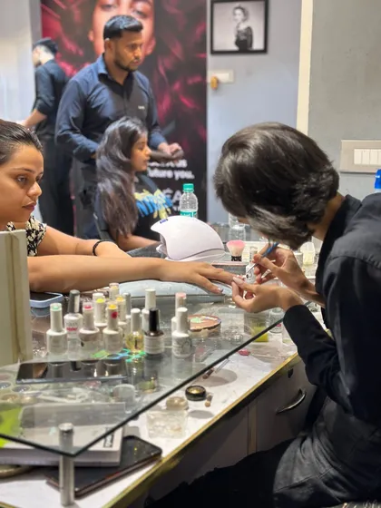 A view of our nail art station, where creativity comes to life. You can see the wide range of polish colors available for clients to choose from.