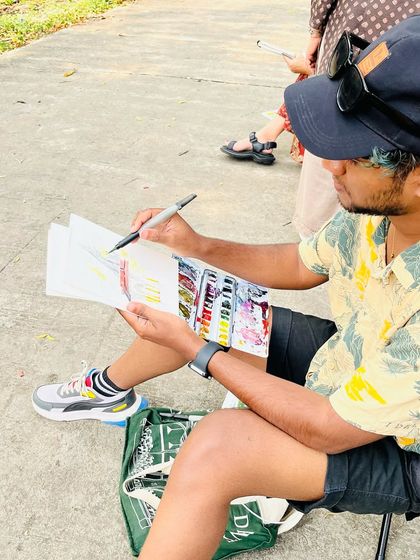 Me in action during the urban sketching session in Nagpur, adding color to my sketch of the temple.