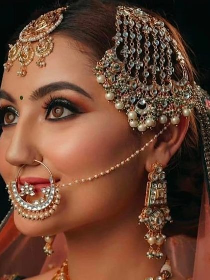 A side profile showcasing a beautiful passa and a large, intricate nath. This highlights the different types of head jewellery I offer to complete your look.