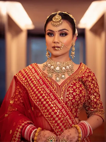 This bride's luxury look features a flawless matte base and a glittery eye. The bold nude lip balances the glam eye makeup, creating a look of elegance with impact.